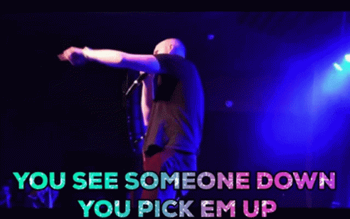 A Man Is Singing Into A Microphone On A Stage With The Words You See Someone Down You Pick Em Up GIF