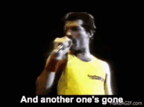 A Man Is Singing Into A Microphone With The Words And Another One 'S Gone Behind Him . GIF