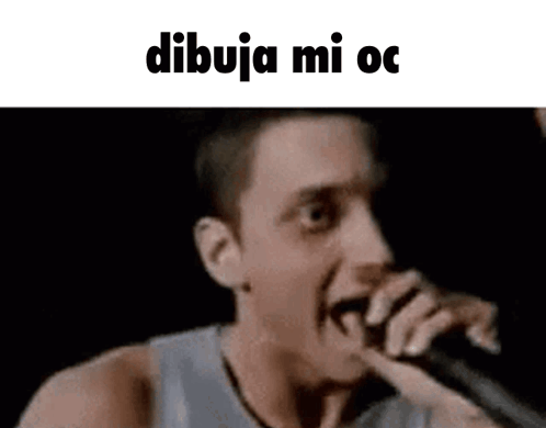 A Man Is Singing Into A Microphone With The Words Dibuja Mi Oc Written On The Bottom . GIF