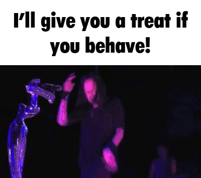 A Man Is Singing Into A Microphone With The Words I 'Ll Give You A Treat If You Behave GIF