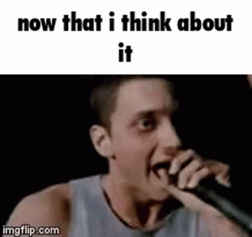 A Man Is Singing Into A Microphone With The Words `` Now That I Think About It '' Written Below Him . GIF