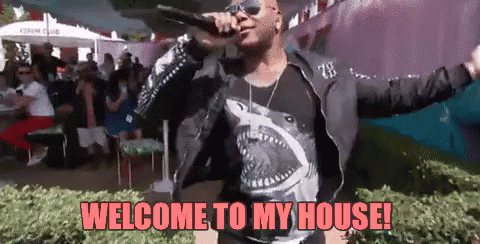 A Man Is Singing Into A Microphone With The Words Welcome To My House Written Below Him GIF