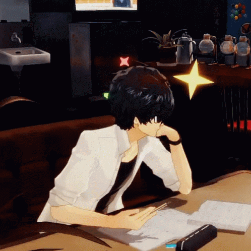 A Man Is Sitting At A Desk With A Book And A Star On His Head GIF