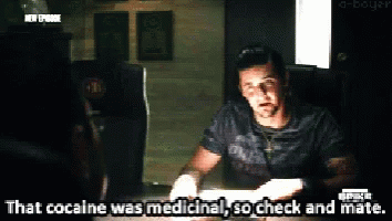 A Man Is Sitting At A Table And Says " That Cocaine Was Medicine " GIF