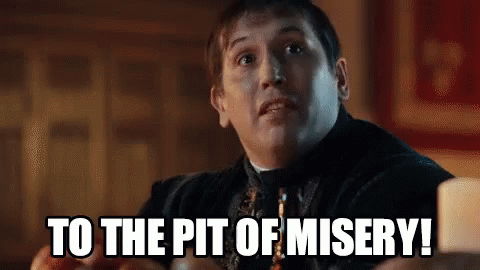 A Man Is Sitting At A Table And Says `` To The Pit Of Misery '' . GIF