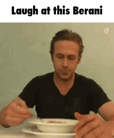 A Man Is Sitting At A Table Eating A Bowl Of Soup With The Caption Laugh At This Berani GIF