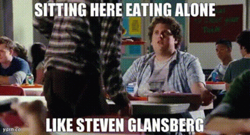 A Man Is Sitting At A Table Eating Alone With A Caption That Says Sitting Here Eating Alone Like Steven Glasberg GIF