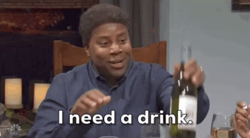 Man Sitting At Table Holding Wine Bottle GIF
