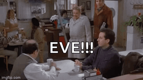 A Man Is Sitting At A Table In A Restaurant Talking To A Woman . GIF