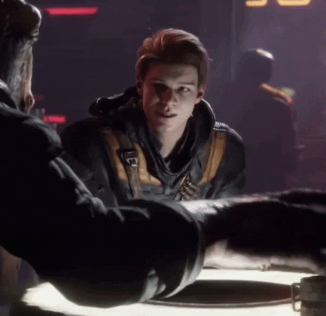 A Man Is Sitting At A Table Talking To Another Man In A Video Game . GIF