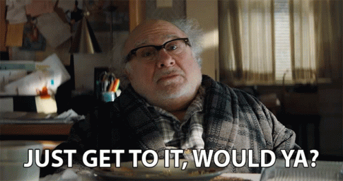 A Man Is Sitting At A Table With A Plate Of Food And Says Just Get To It Would Ya GIF