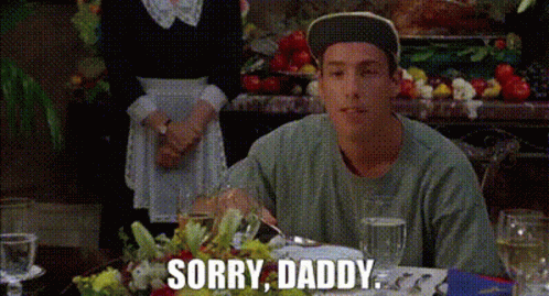A Man Is Sitting At A Table With A Woman Behind Him And Says Sorry Daddy GIF