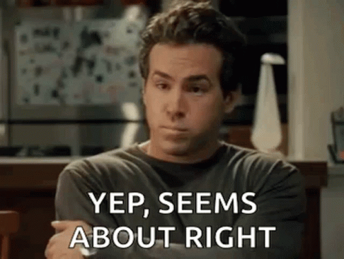 A Man Is Sitting At A Table With His Arms Crossed And Says `` Yep , Seems About Right '' GIF