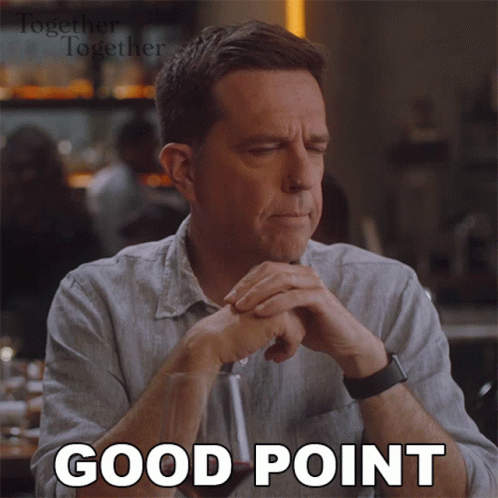 A Man Is Sitting At A Table With His Eyes Closed And The Words Good Point Written On His Face GIF