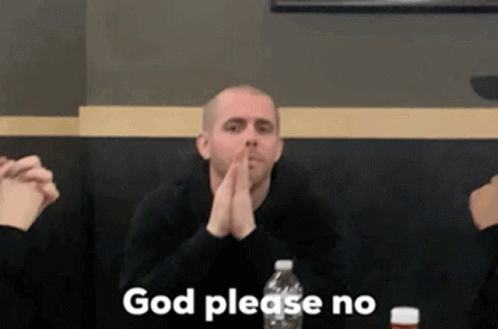 A Man Is Sitting At A Table With His Hands Folded And The Words `` God Please No '' Written Above Him . GIF
