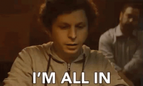 A Man Is Sitting At A Table With His Mouth Open And Says `` I 'M All In '' . GIF