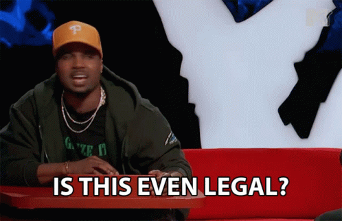 A Man Is Sitting At A Table With The Words Is This Even Legal GIF