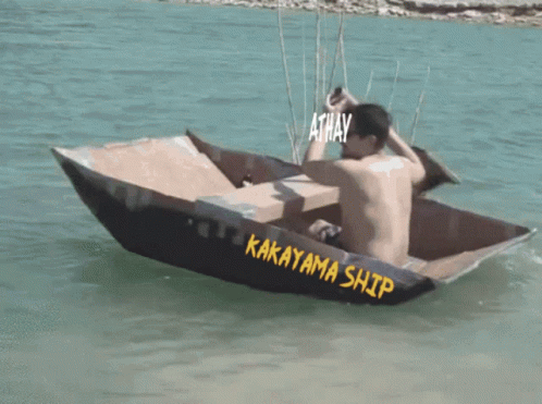 A Man Is Sitting In A Boat That Says Kakayama Ship GIF