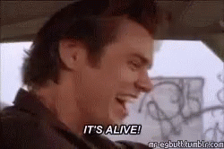A Man Is Sitting In A Car And Saying `` It 'S Alive ! '' GIF