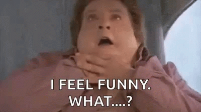 A Man Is Sitting In A Car With His Hands On His Mouth And Says `` I Feel Funny . What ... ? '' GIF