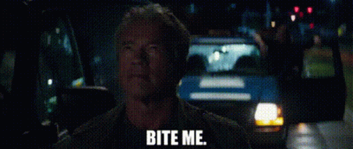 A Man Is Sitting In A Car With The Words `` Bite Me '' Written On The Screen . GIF