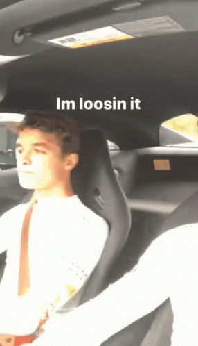 A Man Is Sitting In A Car With The Words Im Loosin It Written Above Him GIF
