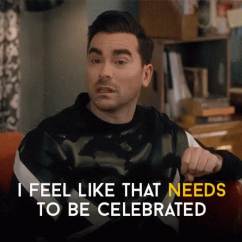A Man Is Sitting In A Chair And Saying I Feel Like That Needs To Be Celebrated GIF
