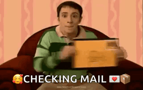 A Man Is Sitting In A Chair Holding An Envelope With The Words Checking Mail Below Him GIF