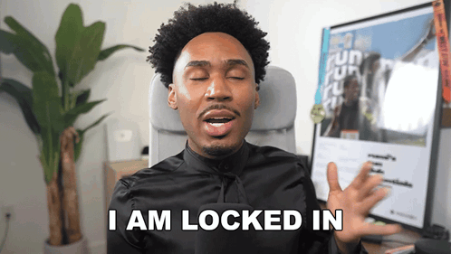 A Man Is Sitting In A Chair With His Eyes Closed And Says " I Am Locked In " GIF