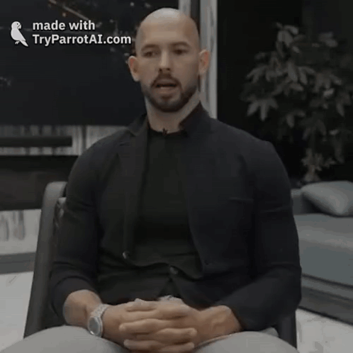 A Man Is Sitting In A Chair With His Eyes Closed And The Words Made With Tryparrotai.com On The Bottom Right GIF