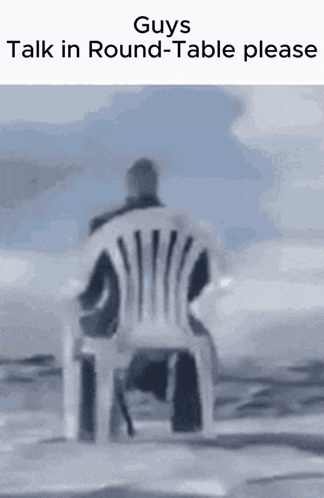 A Man Is Sitting In A Chair With The Words " Guys Talk In Round-Table Please " Above Him GIF