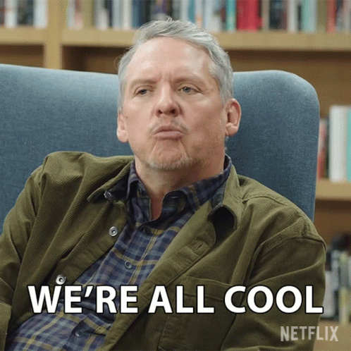 A Man Is Sitting In A Chair With The Words We 'Re All Cool On The Bottom GIF
