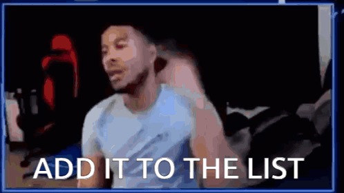 A Man Is Sitting In Front Of A Computer With The Words `` Add It To The List '' Written On The Screen . GIF