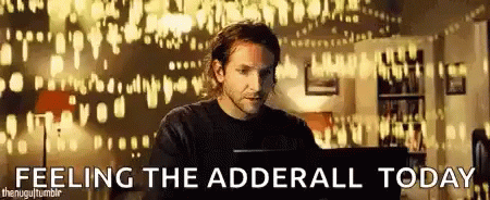 A Man Is Sitting In Front Of A Computer With The Words `` Feeling The Adderall Today '' Written On The Bottom . GIF