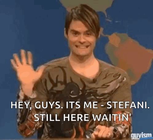 A Man Is Sitting In Front Of A Map Of The World And Waving His Hand . GIF