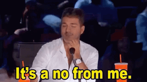 A Man Is Sitting In Front Of A Microphone With His Eyes Closed And Saying `` It 'S A No From Me '' . GIF