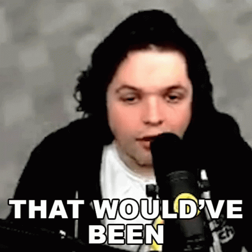 A Man Is Sitting In Front Of A Microphone With The Words `` That Would 'Ve Been '' Written Below Him . GIF