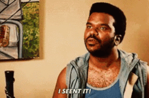 A Man Is Sitting In Front Of A Painting And Says `` I Seen It '' . GIF