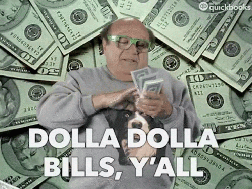 A Man Is Sitting In Front Of A Pile Of Money And Holding A Bunch Of Money In His Hands . GIF