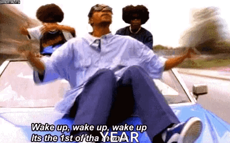 A Man Is Sitting In The Back Of A Car With The Words Wake Up Wake Up Wake Up Its The 1St Of The Year GIF