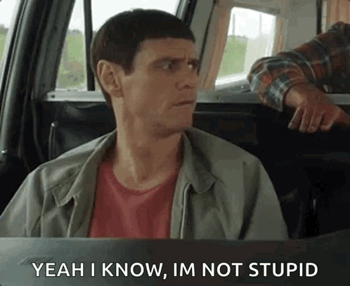 A Man Is Sitting In The Back Seat Of A Car And Saying Yeah I Know , Im Not Stupid . GIF