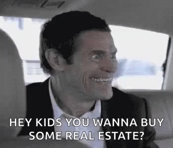 A Man Is Sitting In The Back Seat Of A Car And Smiling . GIF