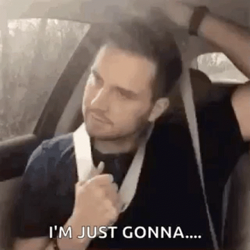 A Man Is Sitting In The Back Seat Of A Car With A Bandage On His Neck . GIF