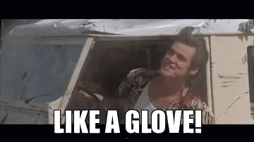 A Man Is Sitting In The Driver 'S Seat Of A Car And Says `` Like A Glove '' . GIF