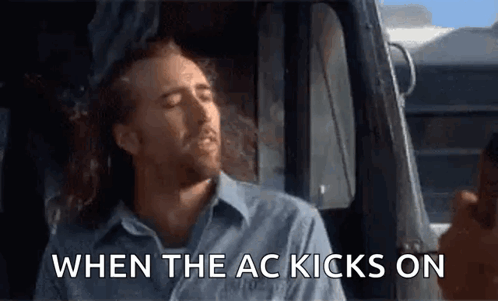A Man Is Sitting In The Driver 'S Seat Of A Truck And Says When The Ac Kicks On GIF