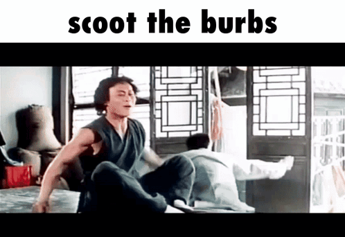 A Man Is Sitting On A Bed In A Room With The Words Scoot The Burbs Written Above Him . GIF