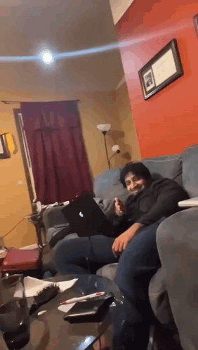 Man Sitting On Couch With Laptop GIF