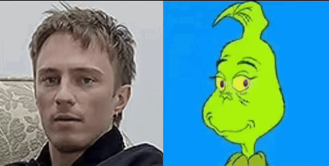 A Man Is Sitting On A Couch Next To A Picture Of A Grinch . GIF