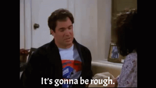 A Man Is Sitting On A Couch Talking To A Woman And Says `` It 'S Gonna Be Rough . '' GIF
