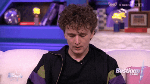Man Sitting On Couch With Bastiaan 23 Ans Pillow GIF